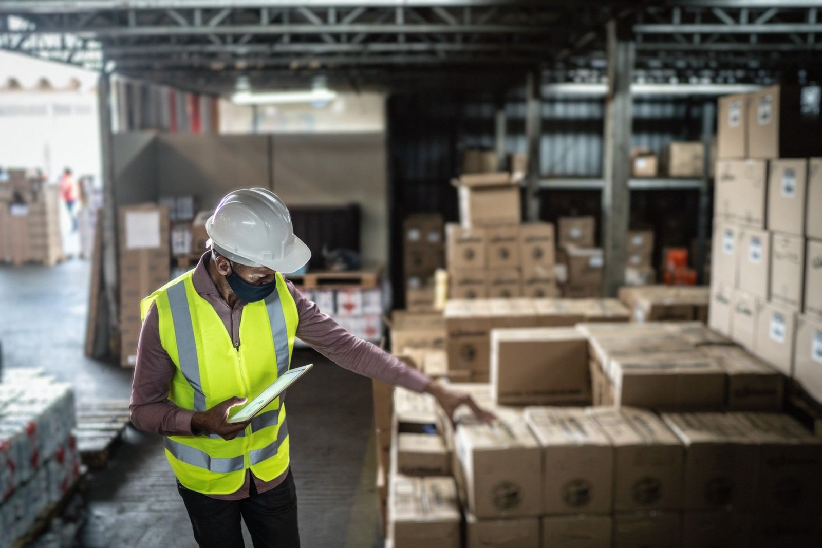 Warehouse inspector checking cartons before container loading